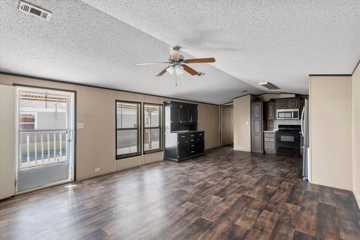 337 Southwest Front Street Bartlett, TX 76511 - Photo 28 of 30 Great view of the great open living room floor plan, overlooking the dining and kitchen area.