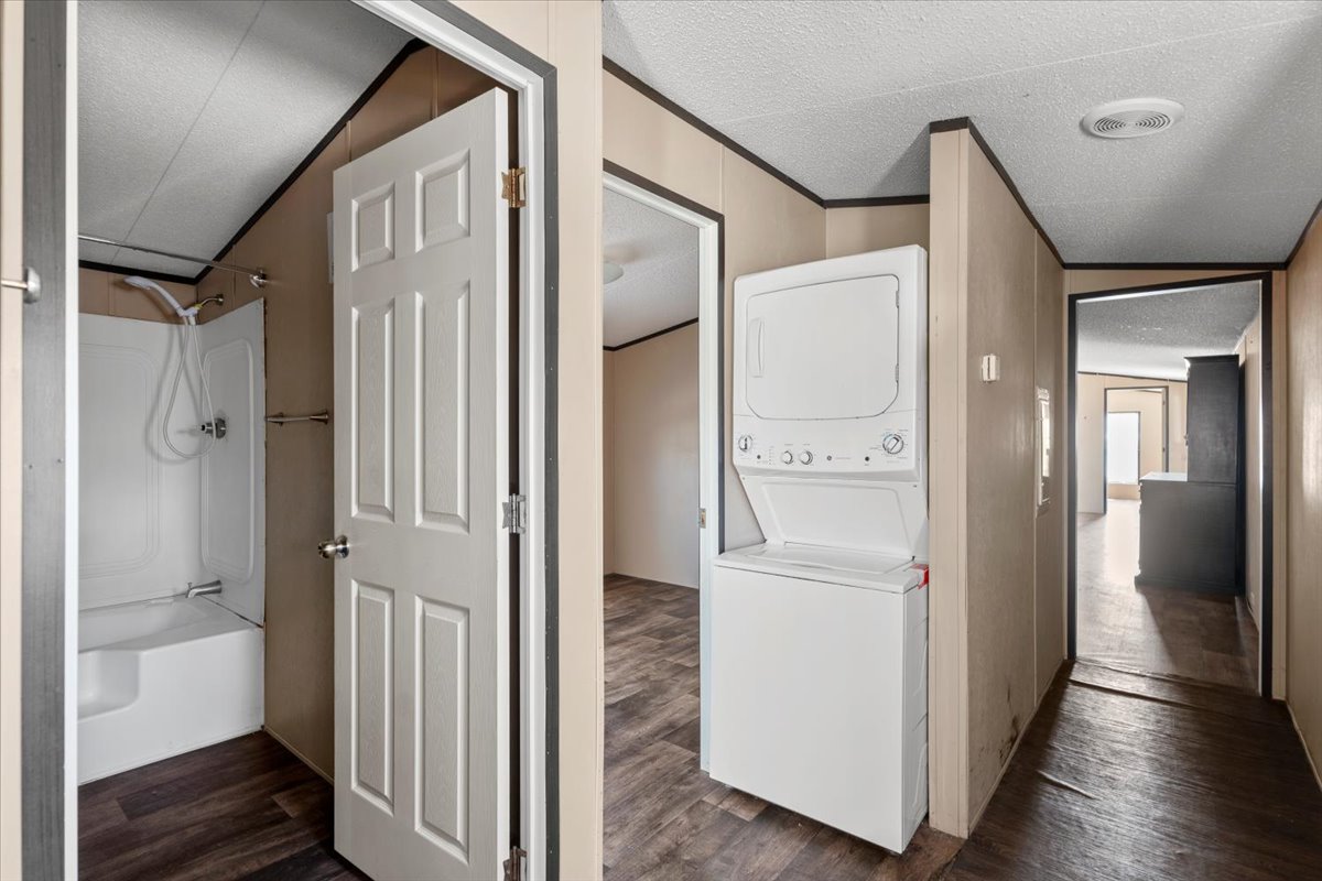 337 Southwest Front Street Bartlett, TX 76511 - Photo 21 of 30 View of hallway, washer and dryer space.