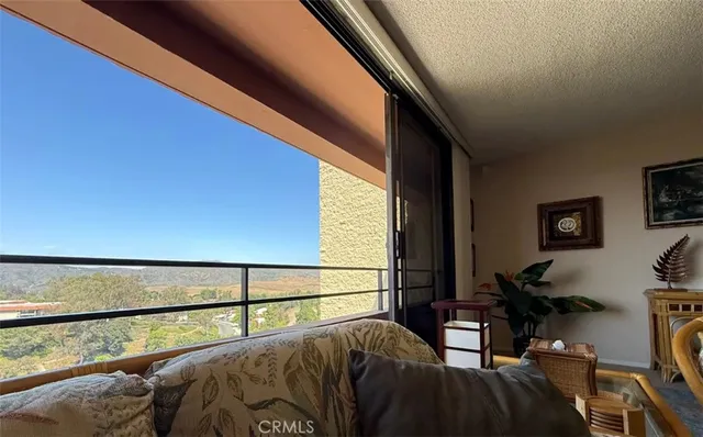 a view of balcony with furniture