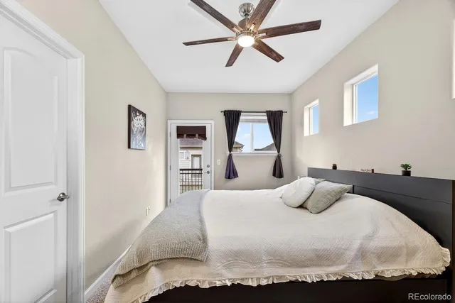 a bedroom with a bed and window