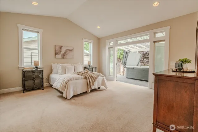 a spacious bedroom with a bed and window