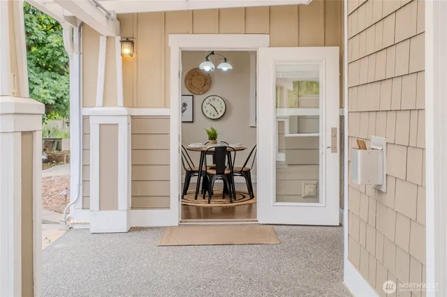 a view of a patio with table and chairs and potted plants