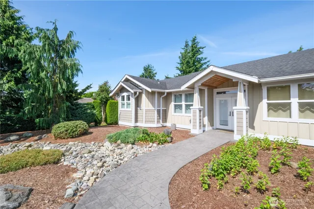 a sign that is sitting in front of flowers