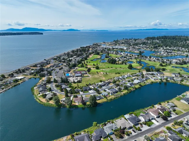 a view of a swimming pool with a lounge chairs