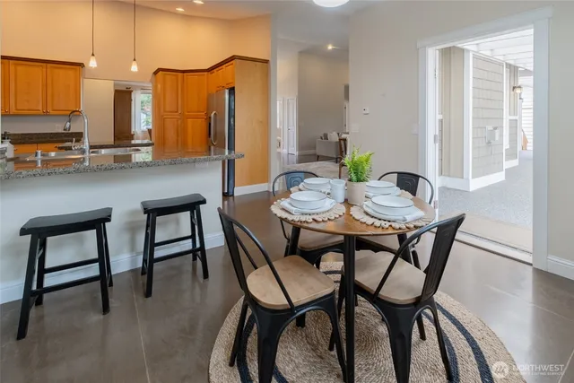 a dining room with furniture and window