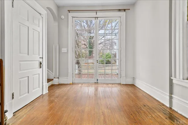 a kitchen with stainless steel appliances granite countertop a refrigerator a stove and a sink