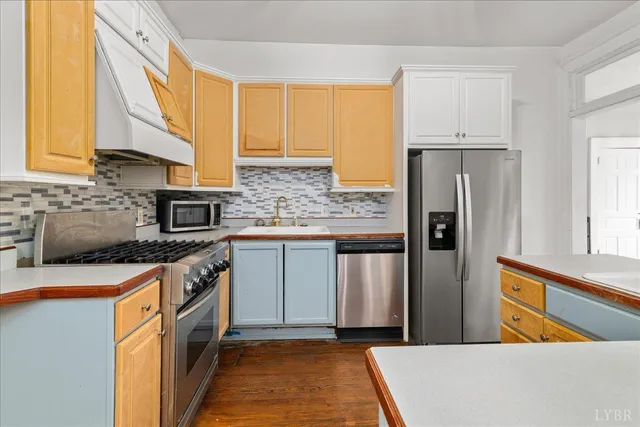 a view of a room with wooden floor and window