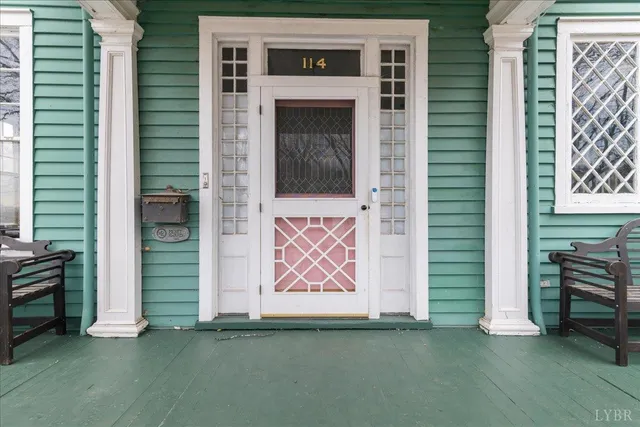 a view of front door and porch of house