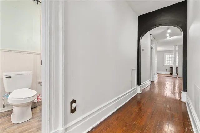 a view of a porch with a floor to ceiling window and wooden fence