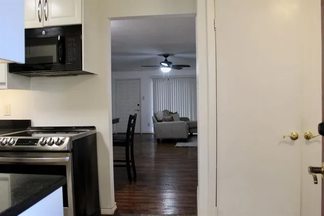 a kitchen with a stove and a microwave
