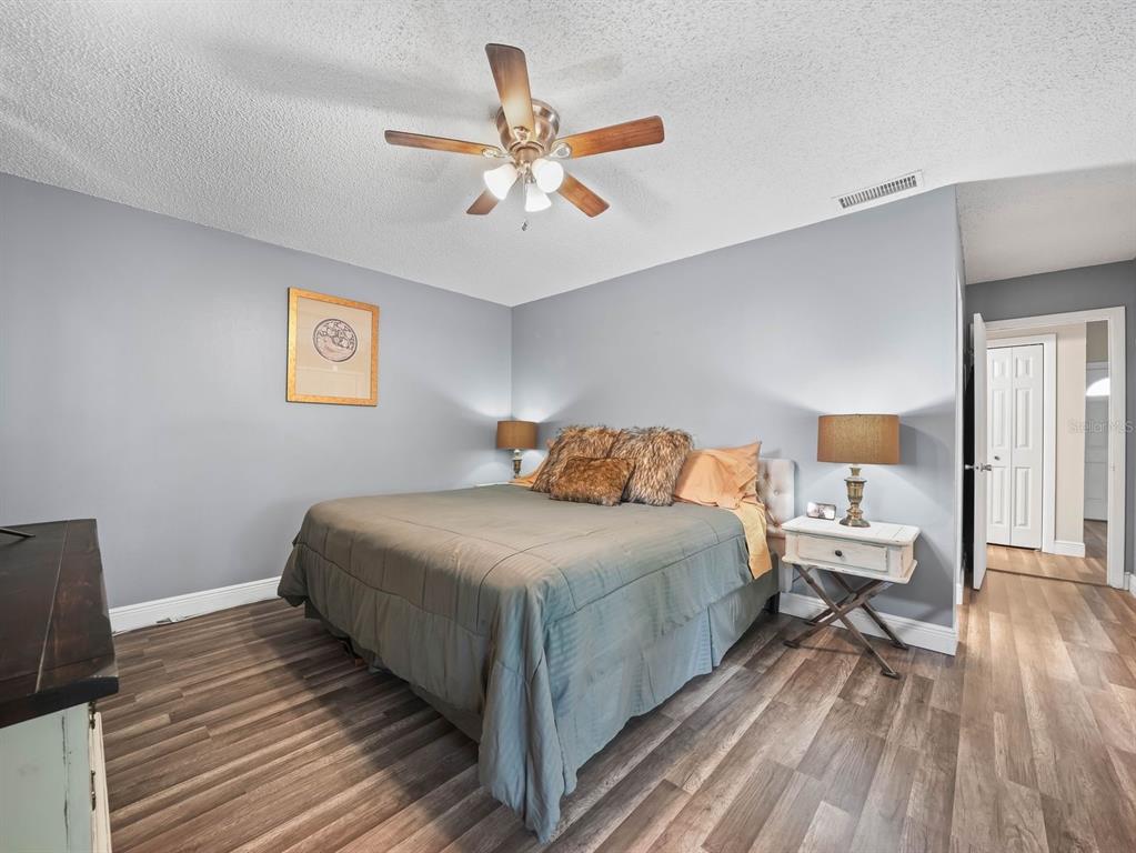 4601 Granada Boulevard Sebring, FL 33872 - Photo 12 of 19 a bedroom with bed and wooden floor