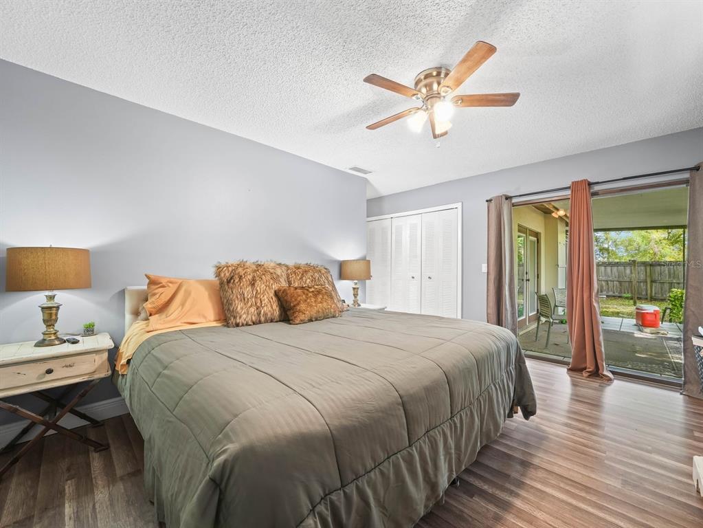 4601 Granada Boulevard Sebring, FL 33872 - Photo 13 of 19 a bedroom with a bed and wooden floor