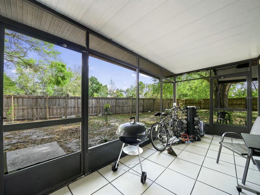 4601 Granada Boulevard Sebring, FL 33872 - Photo 16 of 19 a living room with furniture and floor to ceiling windows