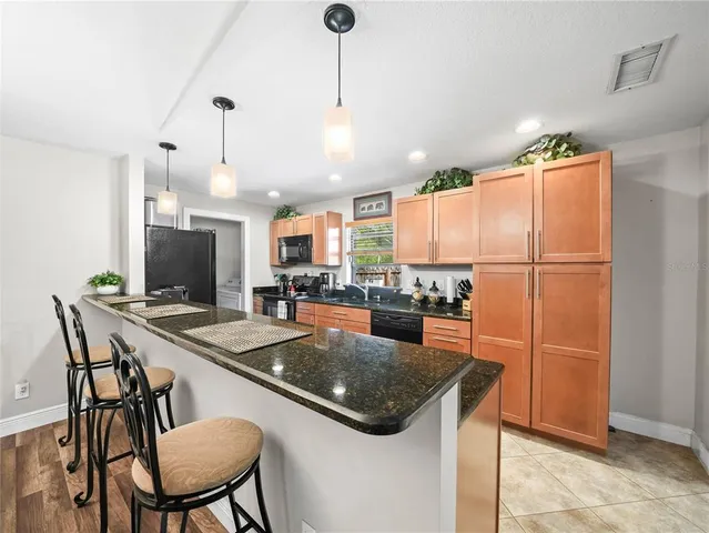 a kitchen with a table and chairs in it