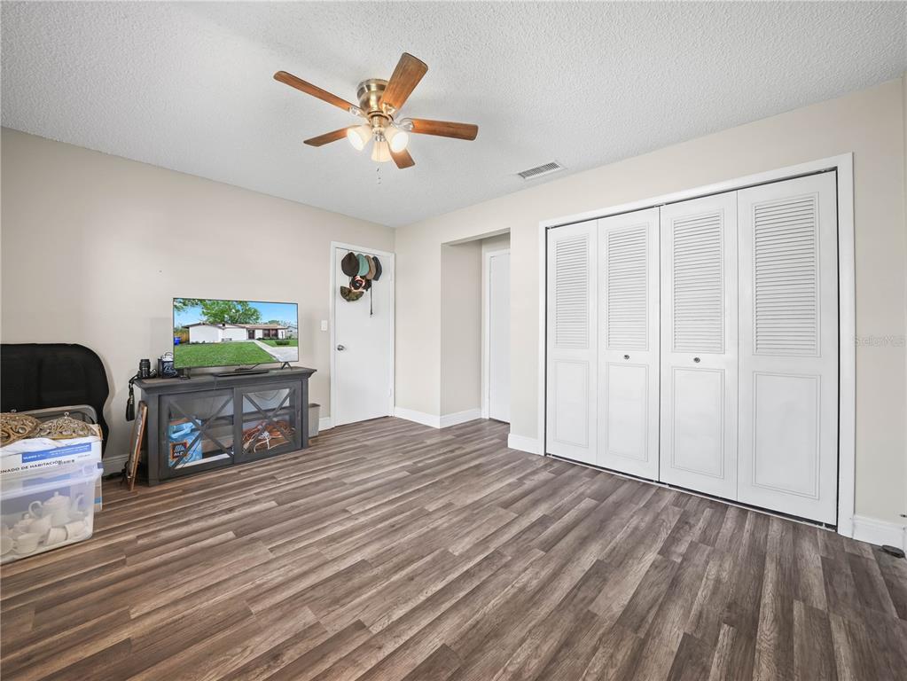 4601 Granada Boulevard Sebring, FL 33872 - Photo 7 of 19 a living room with furniture and a wooden floor
