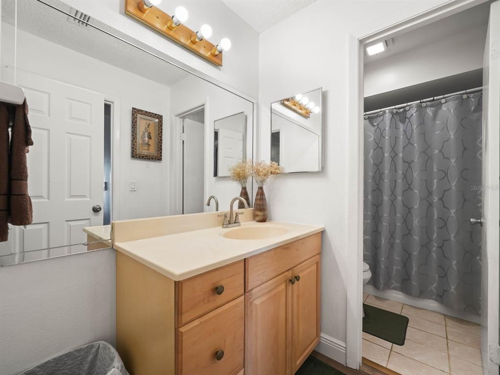4601 Granada Boulevard Sebring, FL 33872 - Photo 9 of 19 a bathroom with a sink vanity and a mirror