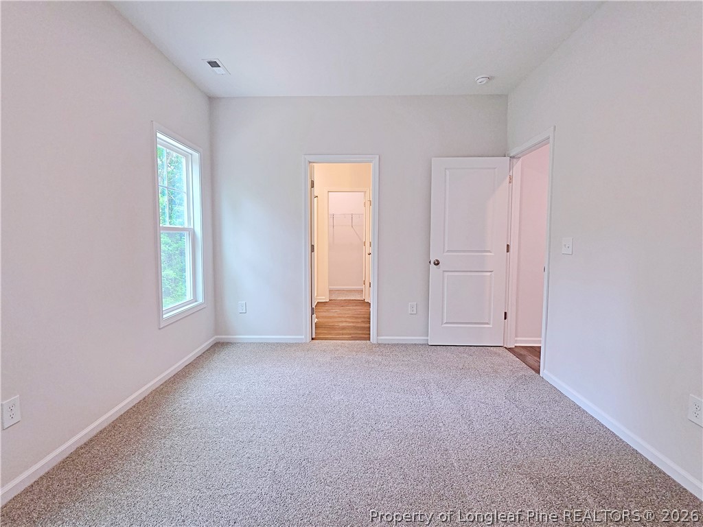 331 Appaloosa Drive Spring Lake, NC 28390 - Photo 13 of 29 a view of an empty room with a window