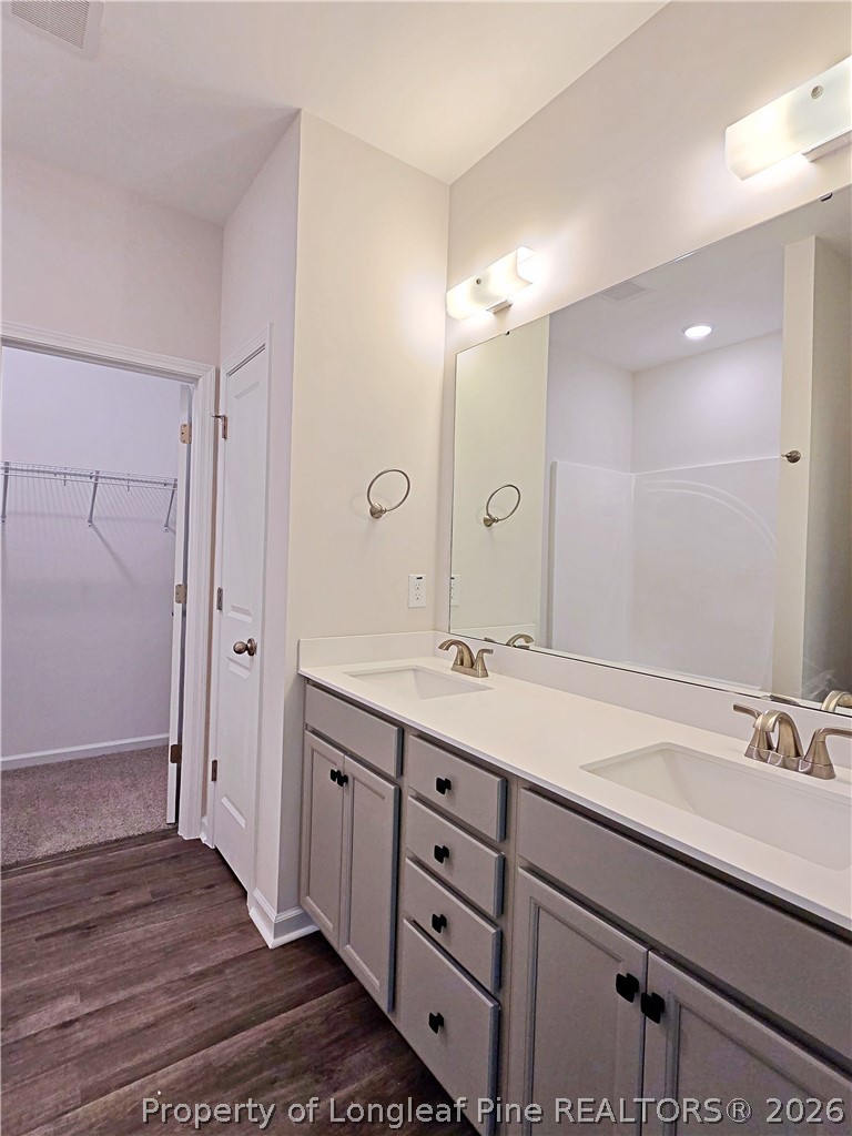 331 Appaloosa Drive Spring Lake, NC 28390 - Photo 14 of 29 a bathroom with a double vanity sink and mirror