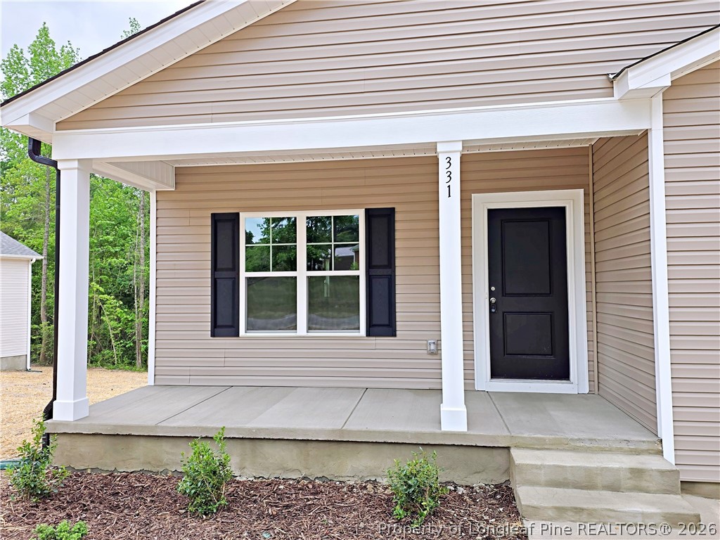 331 Appaloosa Drive Spring Lake, NC 28390 - Photo 2 of 29 a front view of a house with a yard