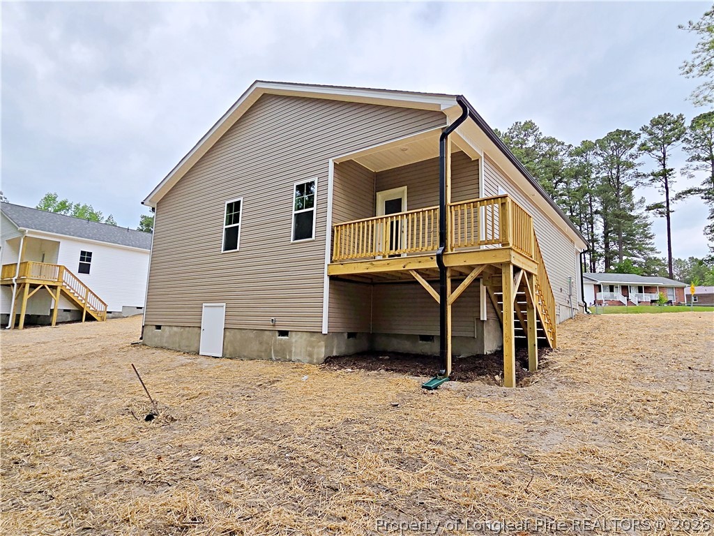 331 Appaloosa Drive Spring Lake, NC 28390 - Photo 28 of 29 a view of a house with a yard covered in snow
