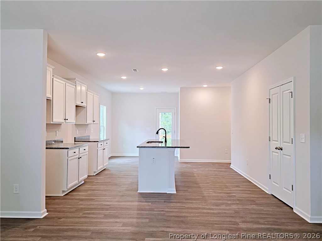 331 Appaloosa Drive Spring Lake, NC 28390 - Photo 5 of 29 a large kitchen with a stove top oven and refrigerator