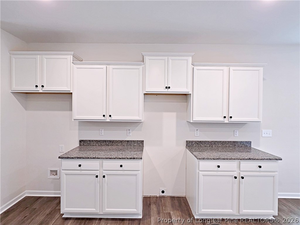 331 Appaloosa Drive Spring Lake, NC 28390 - Photo 9 of 29 a kitchen with granite countertop white cabinets and white appliances