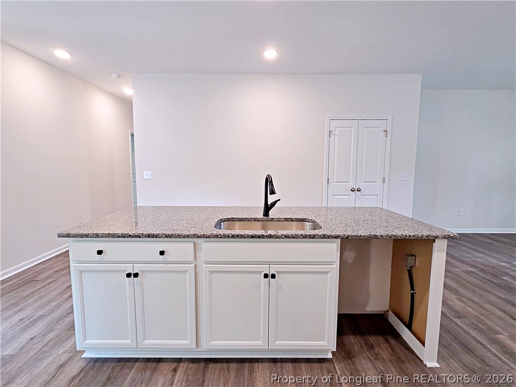 331 Appaloosa Drive Spring Lake, NC 28390 - Photo 10 of 29 a kitchen with granite countertop white cabinets and sink
