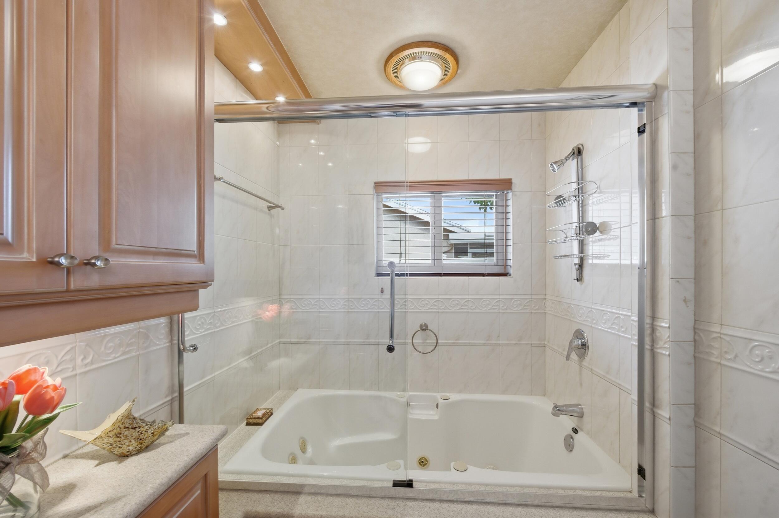 4780 Brandywine Drive Boca Raton, FL 33487 - Photo 20 of 43 a bathroom with a tub