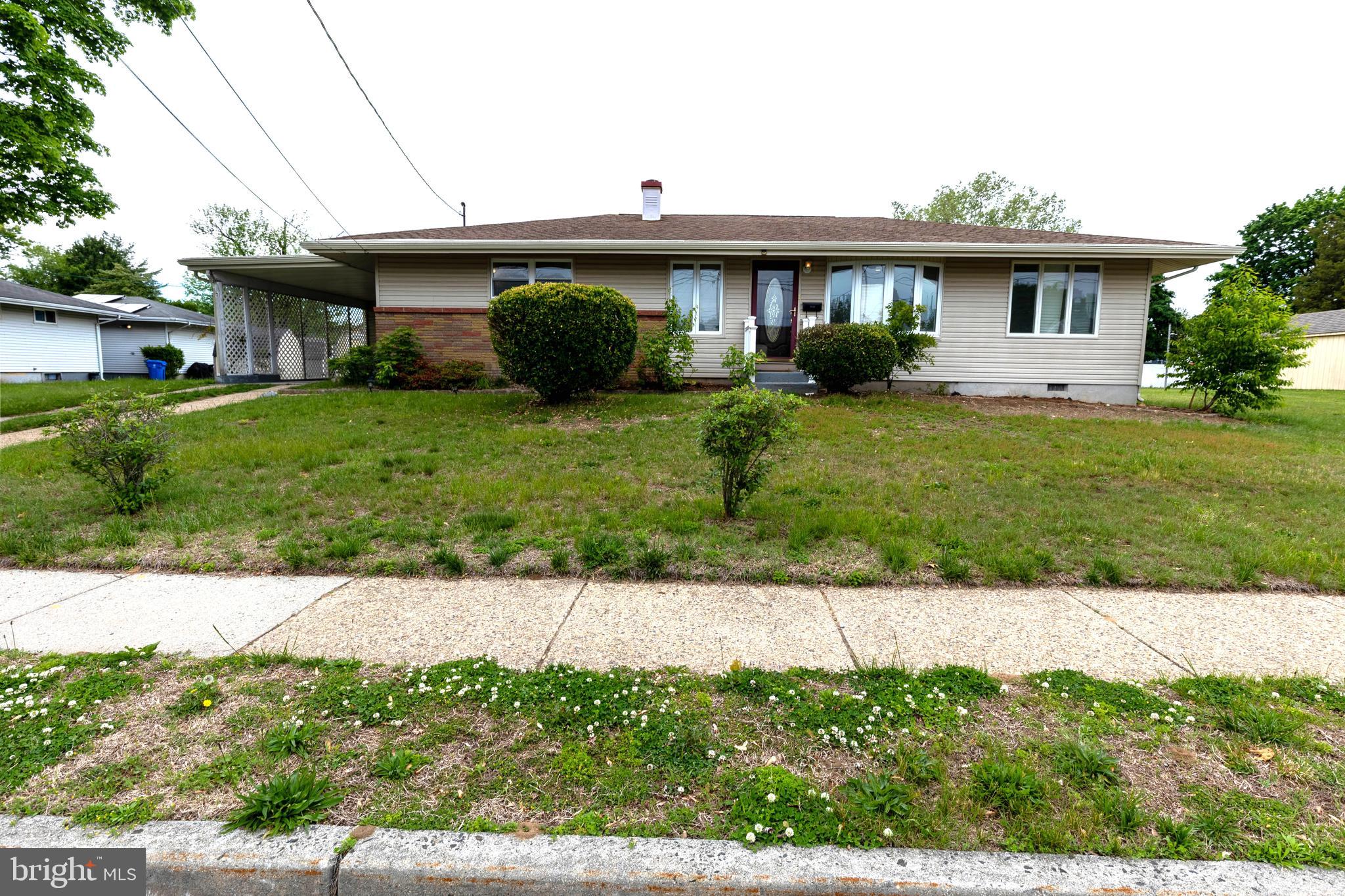 7 Lansdowne Road Burlington, NJ 08016 - Photo 1 of 8 a front view of a house with a garden