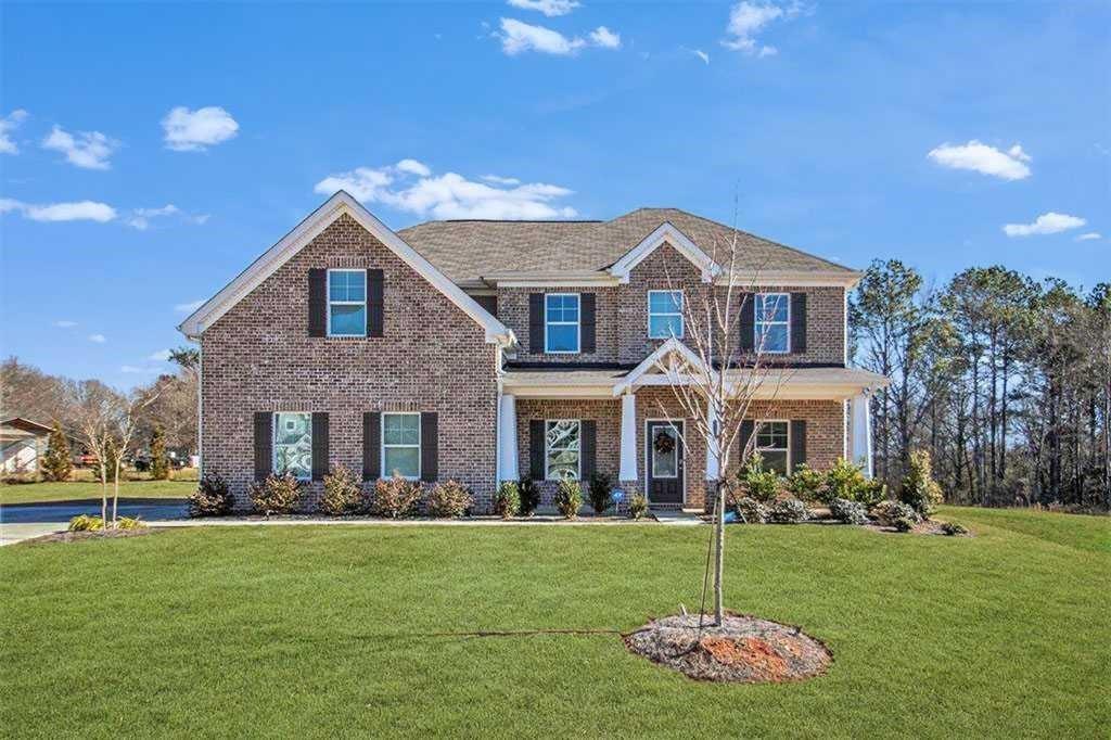 1101 Longleaf Trace Monroe, GA 30656 - Photo 2 of 36 a front view of a house with a yard
