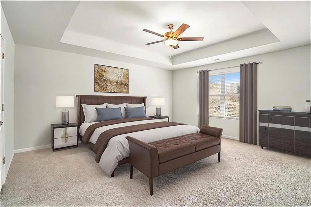 1101 Longleaf Trace Monroe, GA 30656 - Photo 22 of 36 a bedroom with a large bed rug and couch