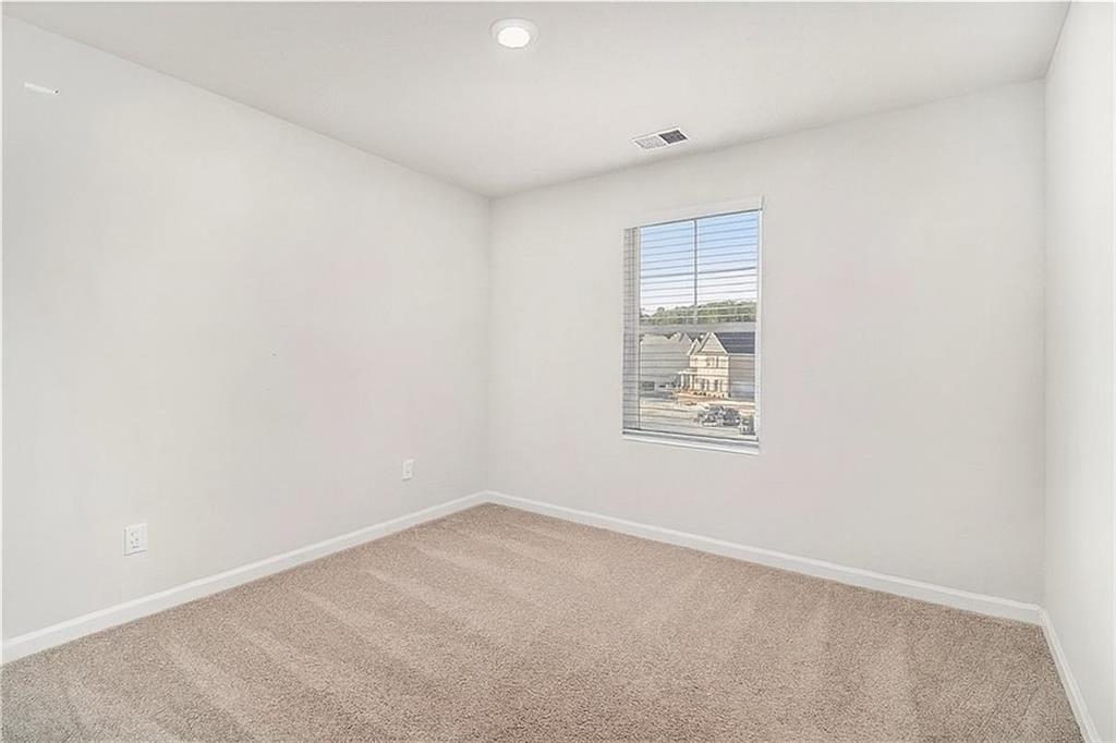 1101 Longleaf Trace Monroe, GA 30656 - Photo 30 of 36 an empty room with a window