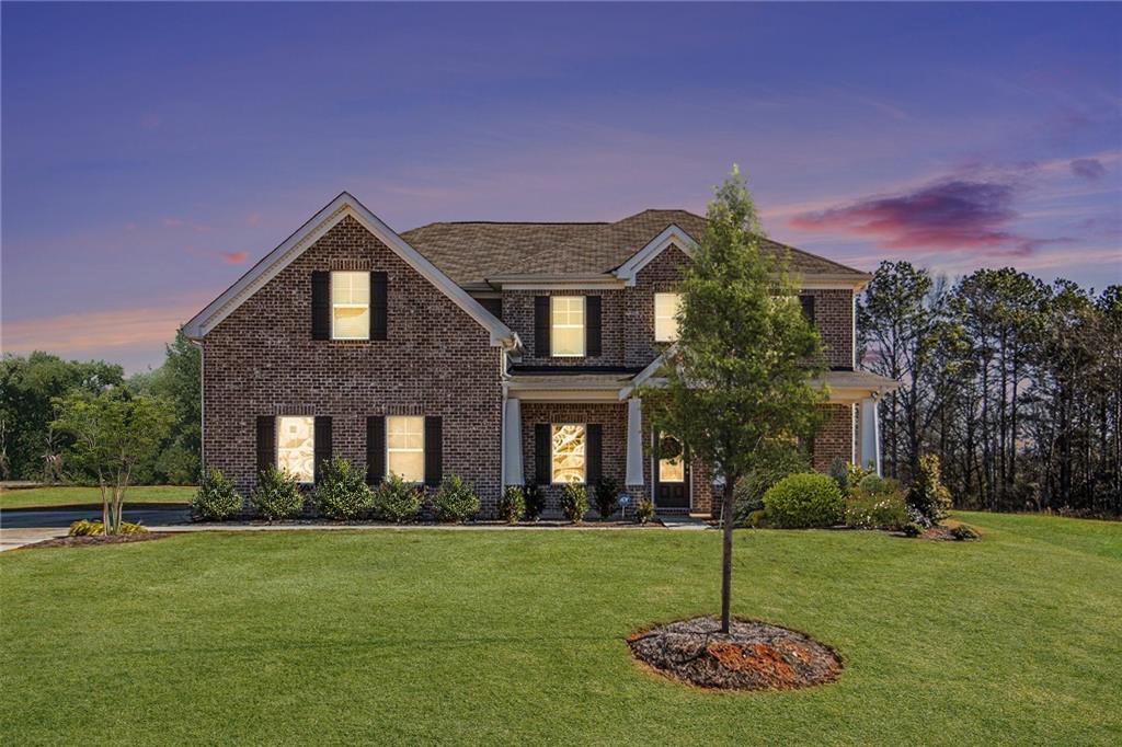 1101 Longleaf Trace Monroe, GA 30656 - Photo 3 of 36 a front view of a house with a yard