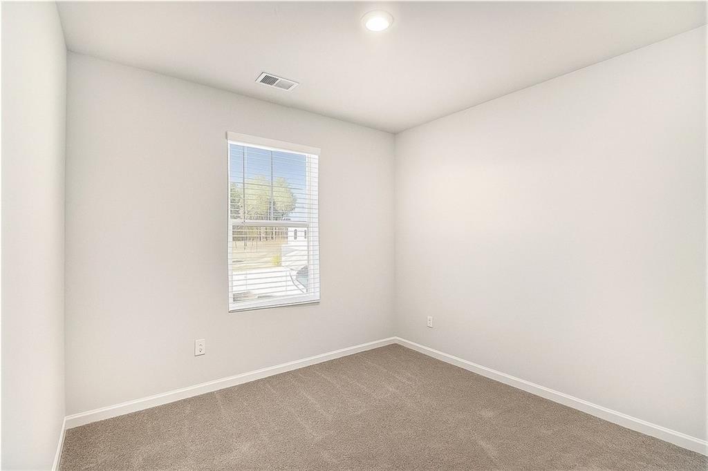 1101 Longleaf Trace Monroe, GA 30656 - Photo 32 of 36 an empty room with a window