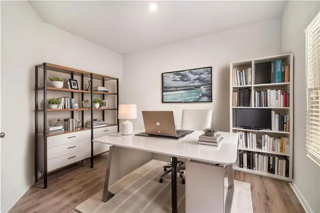 a workspace with furniture and book shelf