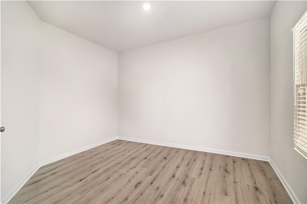 1101 Longleaf Trace Monroe, GA 30656 - Photo 7 of 36 a view of wooden floor in a room