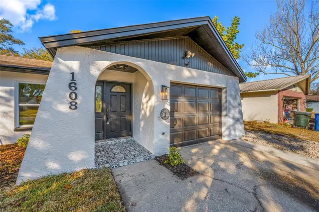 a front view of a house with parking