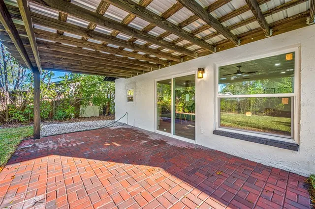 a view of backyard with large windows