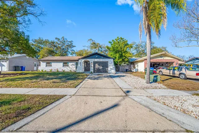 a view of house with outdoor space and sitting area