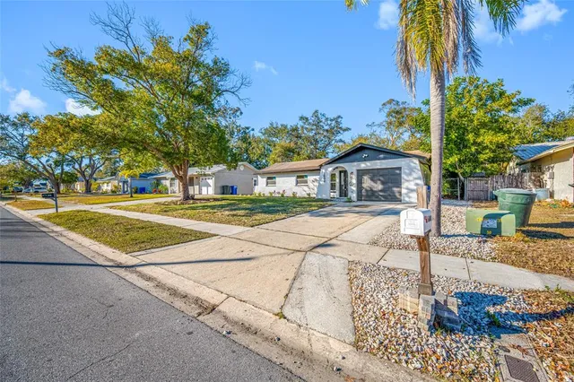 a view of a house with basketball court