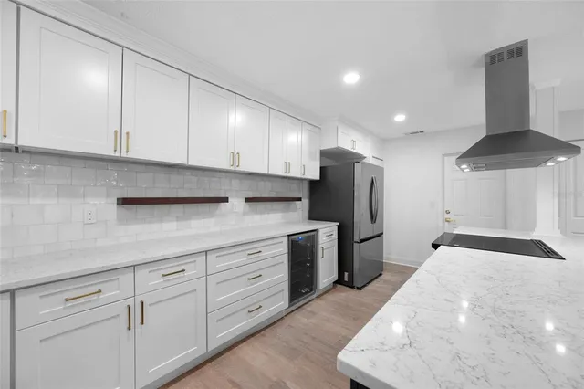 a kitchen with a sink cabinets and stainless steel appliances
