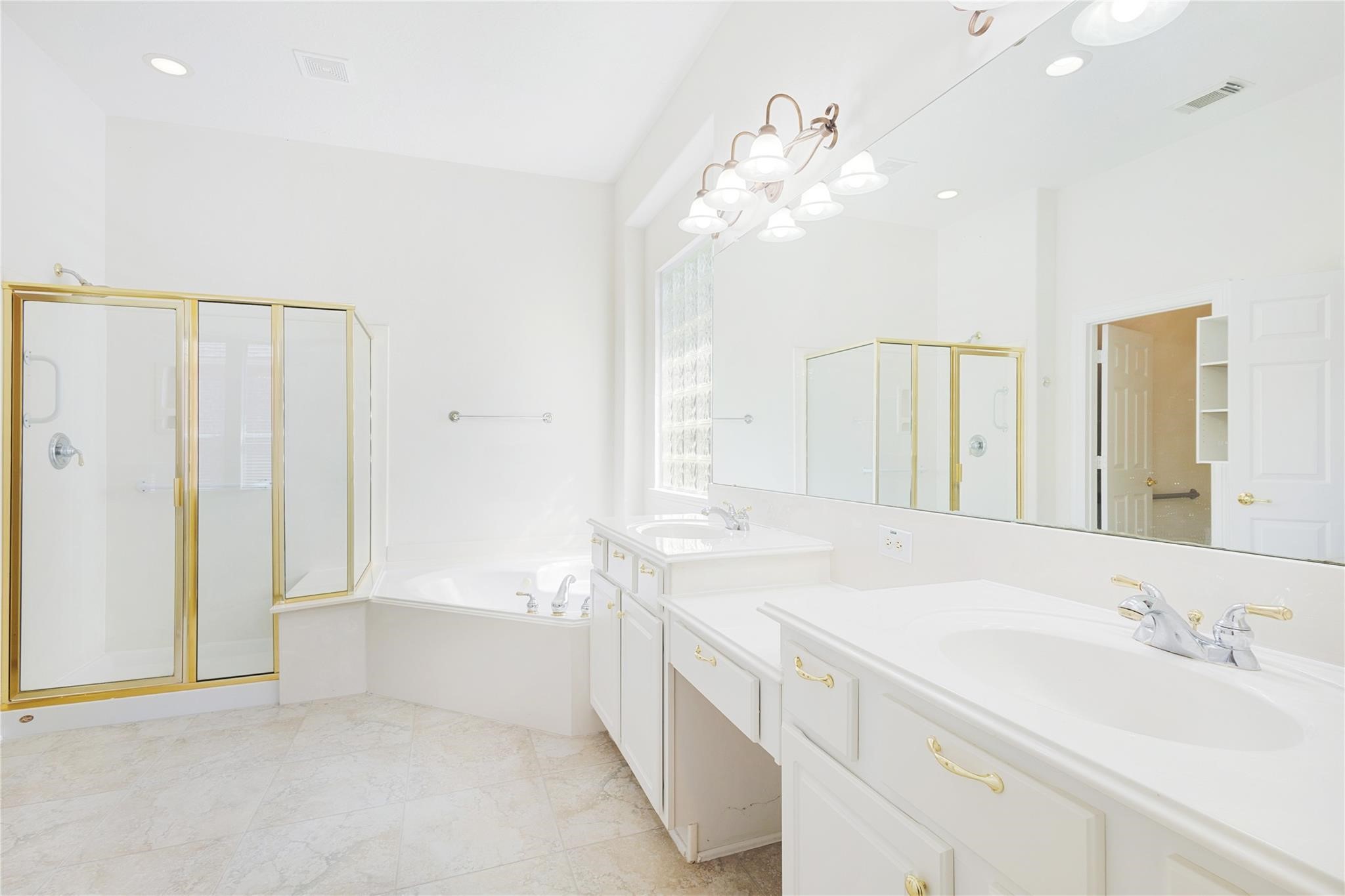 43 Tarrytown Way Conroe, TX 77384 - Photo 24 of 40 a bathroom with a sink a vanity and a mirror