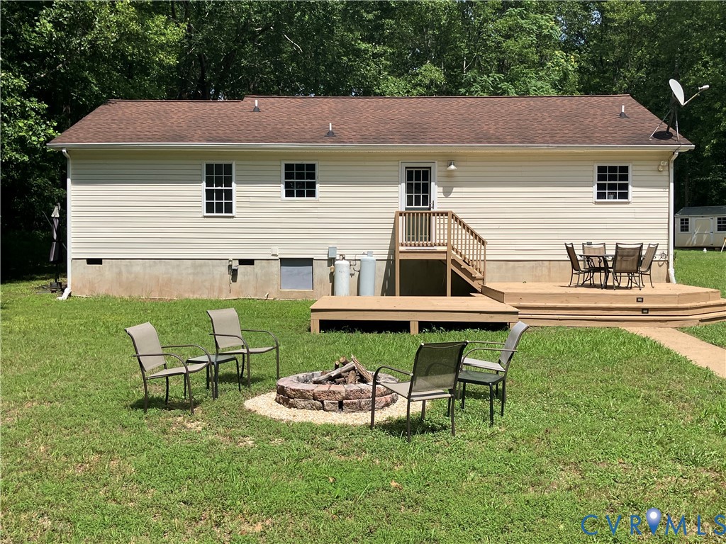 1375 Gills Road Powhatan, VA 23139 - Photo 1 of 10 Rear of the home showing deck, open yard, fire-pit