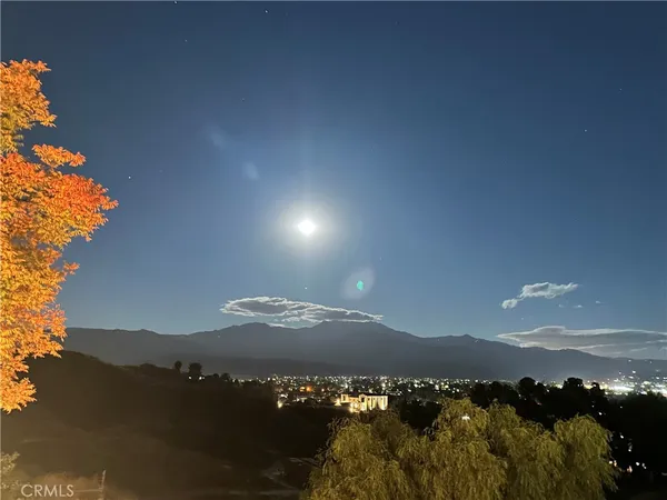 a view of mountain and sunset