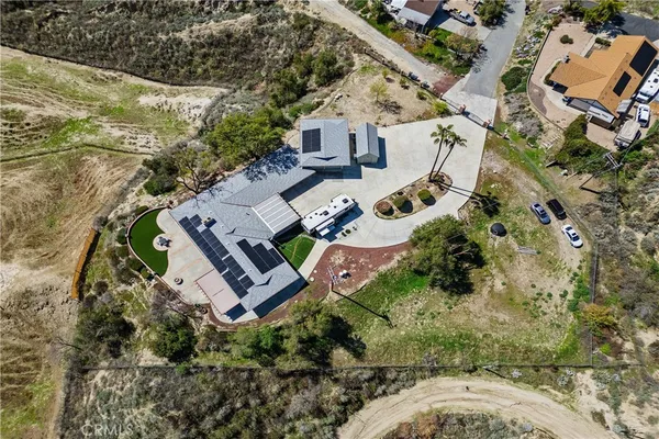an aerial view of residential house with outdoor space