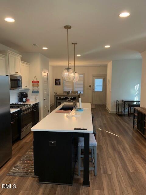 283 Daniel Ridge Road Wendell, NC 27591 - Photo 4 of 9 a kitchen with kitchen island a counter top space a sink stainless steel appliances and cabinets