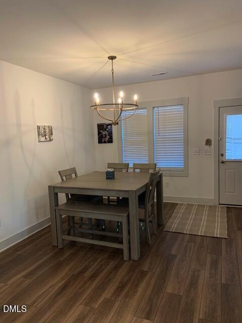 283 Daniel Ridge Road Wendell, NC 27591 - Photo 5 of 9 a living room with a table and chairs