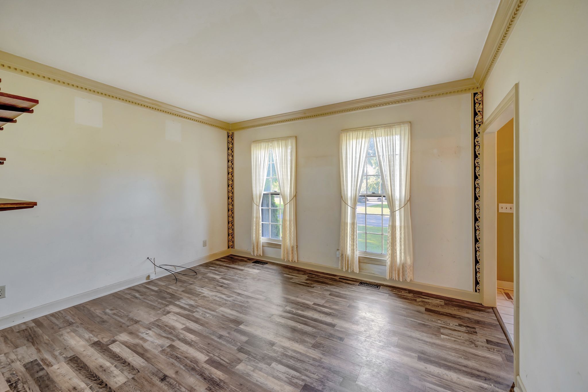 8777 Lebanon Road Mount Juliet, TN 37122 - Photo 23 of 47 a view of an empty room with wooden floor and a window