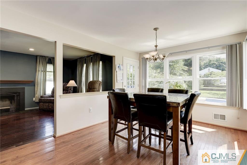 25 Crescent Road Old Bridge, NJ 08857 - Photo 12 of 25 a view of a dining room with furniture window and wooden floor