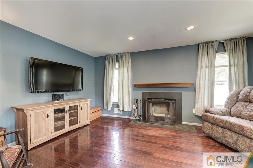 25 Crescent Road Old Bridge, NJ 08857 - Photo 13 of 25 a living room with furniture and a flat screen tv